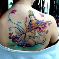 Nice and beautiful looking colored upper back tattoo of Hinduism woman with music instrument