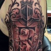 Nice black and white England native family crest tattoo on shoulder