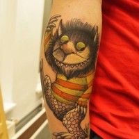Nice colorful big forearm tattoo of fantasy funny monster