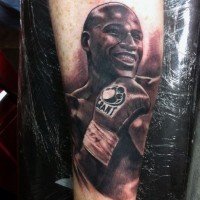 Nice detailed black ink famous boxer portrait tattoo on arm