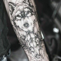 Nice dot style forearm tattoo of animal skull with wolf head