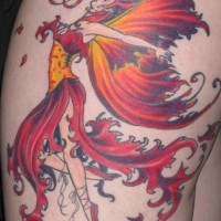 Nice fiery dancing fairy tattoo on thigh