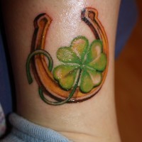 Nice green clover and horseshoe tattoo