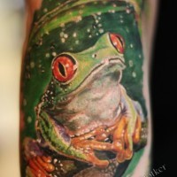 Nice green frog sitting in rain tattoo