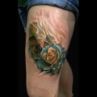 Nice looking 3D colored rose flower tattoo on thigh with human skull