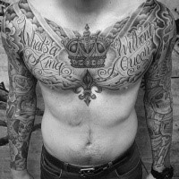 Nice looking black and white chest tattoo of lettering and crown