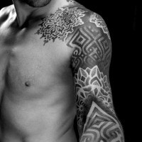 Nice looking black ink big ornamental tattoo on sleeve and shoulder