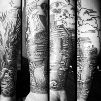 Nice looking black ink old house tattoo on forearm with cemetery and moon