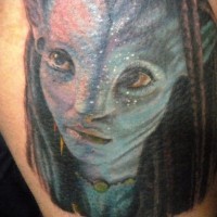 Nice looking colored Avatar woman portrait tattoo on thigh