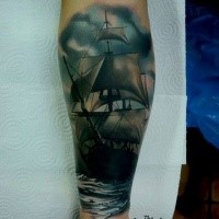 Nice looking colored forearm tattoo of sailing ship