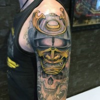 Nice looking colored samurai warrior helmet tattoo on shoulder combined with human skull