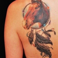 Nice looking colored scapular tattoo of dream catcher stylized with horse head