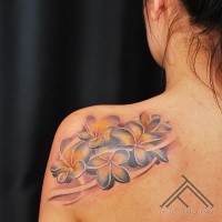 Nice looking illustrative style shoulder tattoo of nice flowers