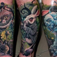 Nice multicolored detailed forearm tattoo of various Alice in wonderland heroes