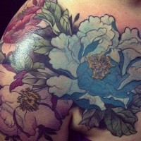 Nice natural looking colored big shoulder tattoo of wildflowers