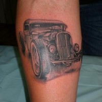 Nice old retro car tattoo on leg