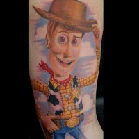Nice painted and colored  arm tattoo of Toy Story cartoon cowboy hero