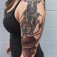 Nice painted and colored big woman Capricorn tattoo on shoulder