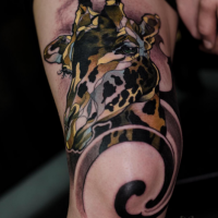 Nice painted and colored leg tattoo of big giraffe head