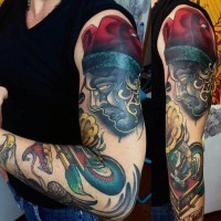 Nice painted and colored mystical clown tattoo on sleeve combined with old gramophone