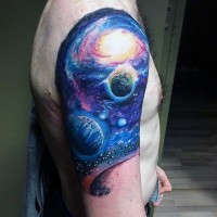 Nice painted and colored space themed shoulder tattoo