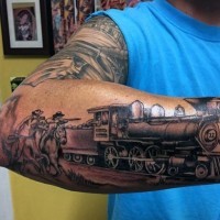 Nice painted black ink old western train with cowboys tattoo on arm