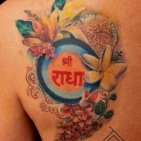 Nice painted colorful various flowers tattoo on shoulder with lettering