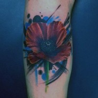 Nice painted little colored flower tattoo on arm