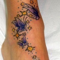 Nice purple butterflies and yellow stars tattoo on foot