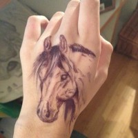 Nice realistic detailed horse head hand tattoo in homemade style