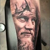 Nice very detailed black and white ol viking portrait tattoo on forearm stylized with sailing ship