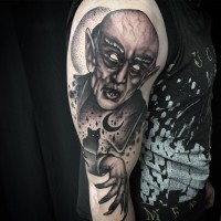 Nosferatu with black cat vampire tattoo on half sleeve