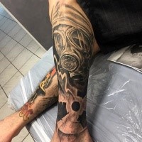 Nuclear war themed black ink leg tattoo of man in gas mask and radiation symbol
