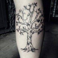 Old cartoon like black ink leg muscle tattoo of blooming tree