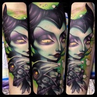 Old cartoon like colored evil witch tattoo on forearm with little crow