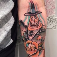 Old cartoon like colored funny gentleman ghost tattoo on forearm combined with beautiful rose