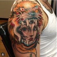 Old cartoons like colored gypsy woman tattoo on shoulder stylized with tiger helmet