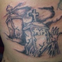 Old cracked graves with arm in graveyard mystical creepy tattoo