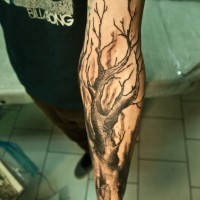 Old dry tree forearm tattoo