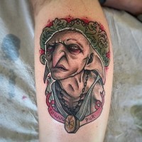 Old fantasy movie colored hero portrait tattoo on forearm with lettering
