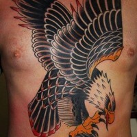 Old flying eagle with skull tattoo on chest