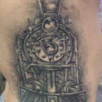 Old looking black ink large train tattoo on side