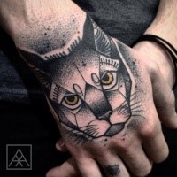 Old looking colored dot style hand tattoo of evil cat head