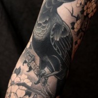 Old school big sleeve tattoo of crow with blooming tree