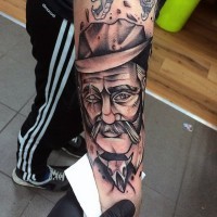 Old school black and white western man tattoo on arm