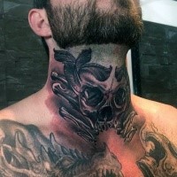 Old school black ink neck tattoo of human skull and bones
