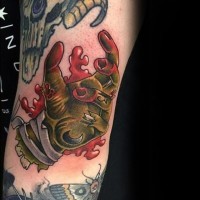 Old school cartoon colored zombie hand tattoo on arm with number