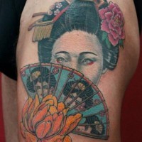 Old school colored Asian woman portrait tattoo on thigh with fan and flowers