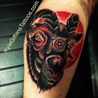 Old school colored cult goat head tattoo on leg stylized with satanic symbol