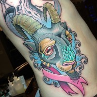 Old school colored sad goat tattoo on side with pink ribbon